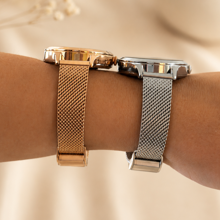 NOVACCHI SOLARA Petite rose gold and silver smartwatches shown from the side, highlighting the slim case and Milanese mesh bands